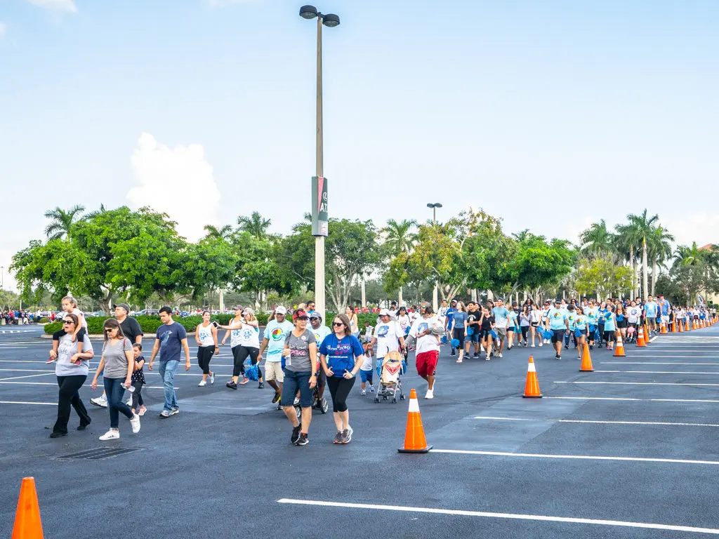 Petland Texas team walking in parking lot at Autism Speaks Walk.