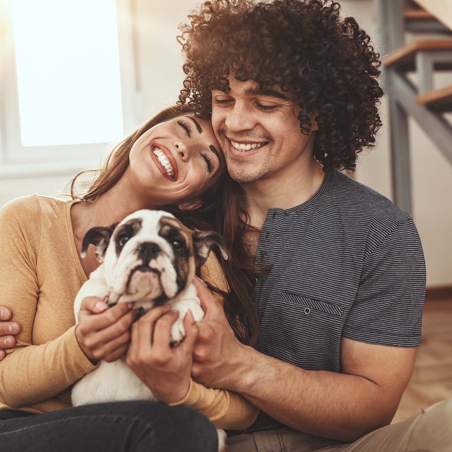A couple welcoming home their new Petland puppy