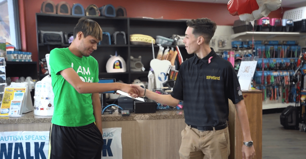 Petland Texas picture of WOW Center patient Angel Rodriguez with a Petland employee at internship.