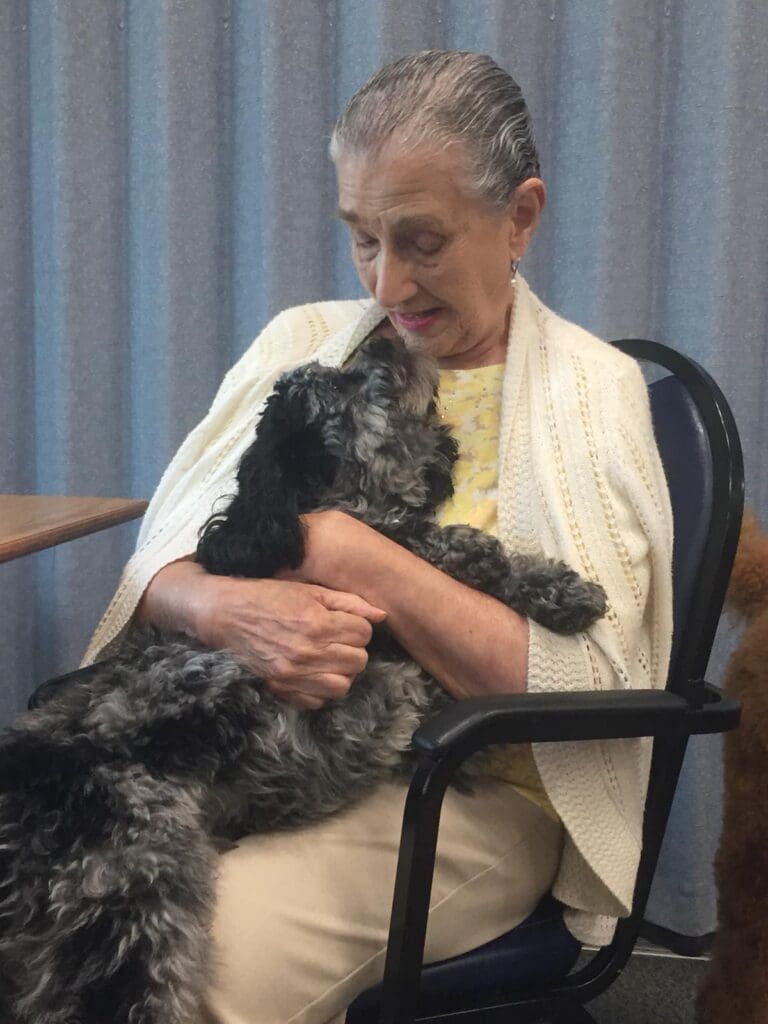 Petland Texas picture of Southwest Focal Point Senior Center patient with a cute Petland puppy.
