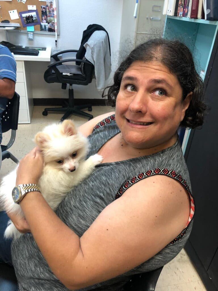 Petland Texas picture of WOW Center patient holding a cute Petland puppy.