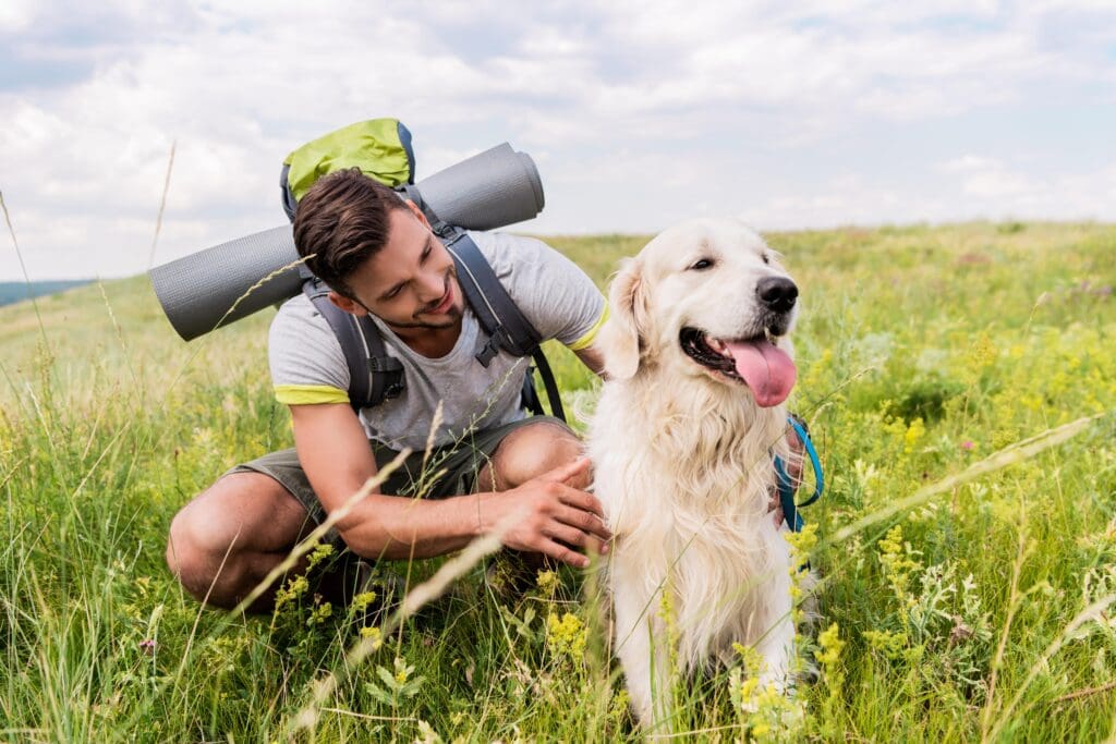 Petland Texas picture of cute puppy with their owner on a hiking trip.